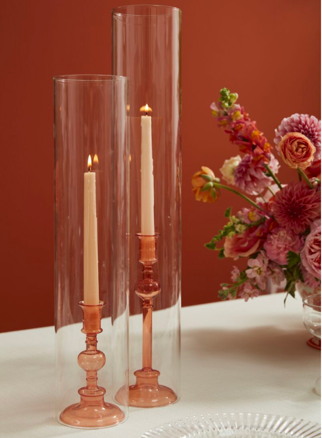 pink candlesticks with glass sleves 